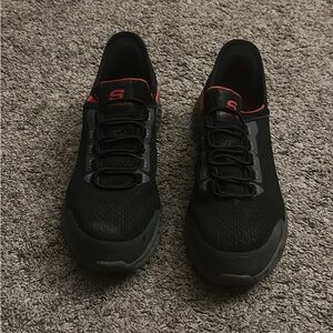 Black and Gray Sneakers with Red Accents -sketchers steel toe shoe